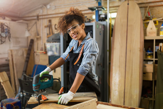 Afro american woman craftswoman working in her workshop

