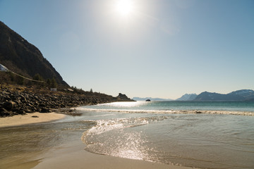 Water at Rorvikstranda beach and Gimsoystraumen fjord near Henningsvaer at Lofoten Islands / Norway