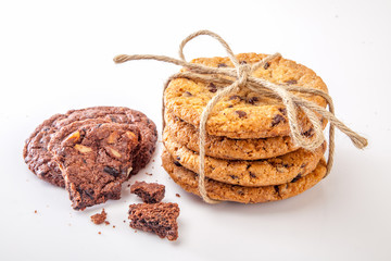 Dairy milk with home made cookies over white background