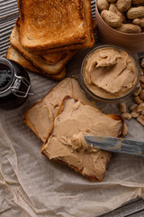 peanut paste on a wooden rustic background
