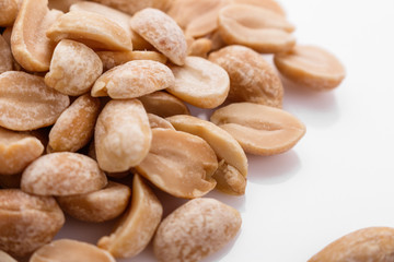 fresh peanuts on a white acrylic background