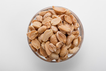 fresh peanuts on a white acrylic background