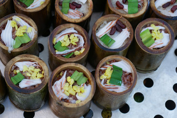 red and white glutinous rice roasted in bamboo joints