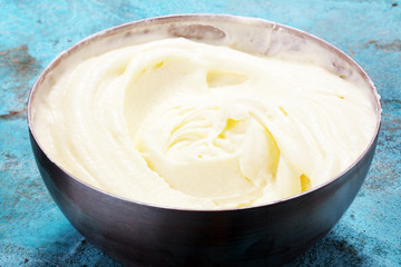 close up of a white whipped or sour cream in bowl.