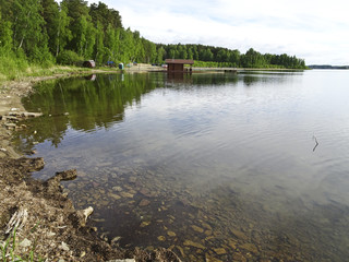 Summer landscape: forest lake in cloudy weather