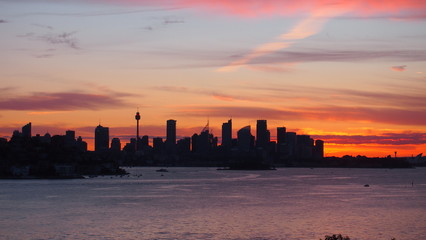 Fototapeta na wymiar Sydney skyline sunset view from Milk Beach