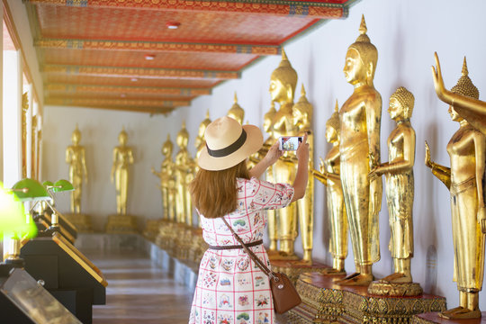 Tourist is traveling inside Wat Pho in Bangkok, Thailand.