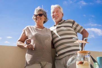 nice beautiful caucasian mature adult couple smile and enjoy leisure activity outdoor together on...