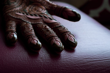 Bridal henna being applied to hands