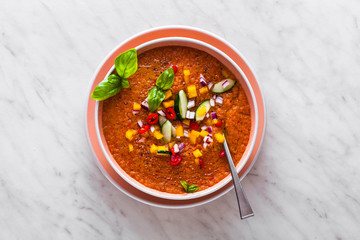 Traditional spanish andalusian tomato cream soup - salmorejo. Salmorejo or gazpacho cream soup on gray bowl
