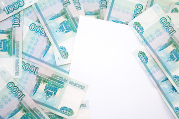 business, finance, saving, banking concept - close up bundle of money Russian Banknotes thousand rubles on wooden table