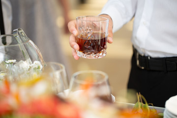 A men holding a whiskey glass