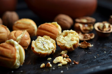 Sweet tasty cookies in form nuts with buttery cream
