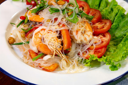 Fresh shrimp spicy salad with vermicelli, thai food delicious in white dish