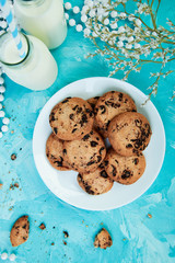 Cookie chocolate with a milk bottles.