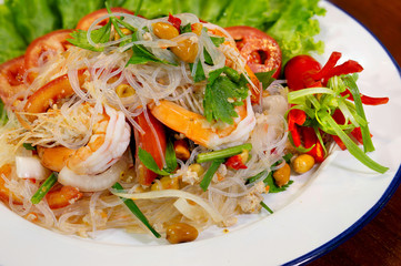 Fresh shrimp spicy salad with vermicelli, thai food delicious in white dish