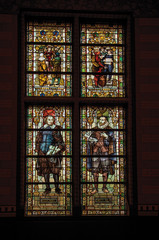 Colorful stained glass window at the Rijksmuseum (National Museum) in Amsterdam. Famous for its huge cultural activity, graceful canals and bridges. Northern Netherlands.
