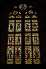 Fototapeta na wymiar Colorful stained glass window at the Rijksmuseum (National Museum) in Amsterdam. Famous for its huge cultural activity, graceful canals and bridges. Northern Netherlands.