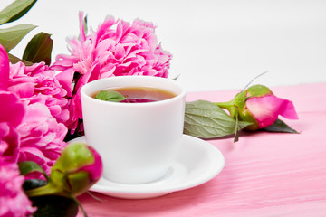 Bouquet Peony flowers and  cup of coffee