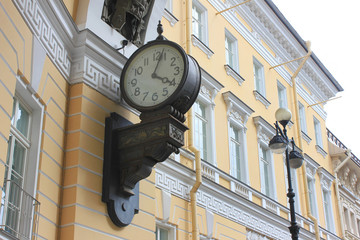 Fototapeta na wymiar Old Vintage Clock on Triumphal Arch of General Staff Building at Palace Square in Saint Petersburg, Russia. Monumental Neoclassical Style Building Architecture Details of St. Petersburg City.
