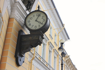 Fototapeta na wymiar Old Vintage Clock on Triumphal Arch of General Staff Building at Palace Square in Saint Petersburg, Russia. Monumental Neoclassical Style Building Architecture Details of St. Petersburg City.