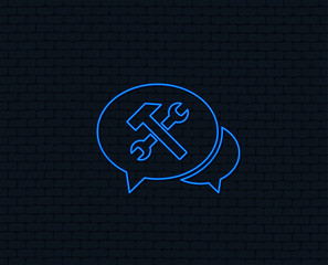 Neon light. Speech bubble repair tool sign icon. Service symbol. Hammer with wrench. Glowing graphic design. Brick wall. Vector