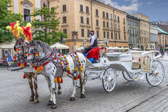 Horse carriages at main square in Krakow, Poland