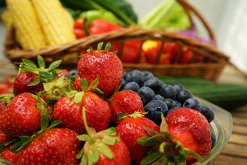 Organic  fruits and vegetables on a wooden table 
