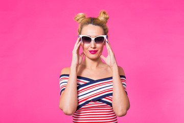 Beauty surprised fashion funny model girl wearing sunglasses. Expressing positive emotions, smile. Beautiful woman