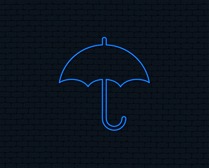 Neon light. Umbrella sign icon. Rain protection symbol. Glowing graphic design. Brick wall. Vector