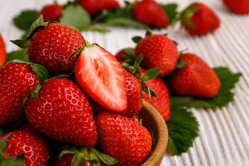 Juicy fresh strawberry on a rustic wooden background