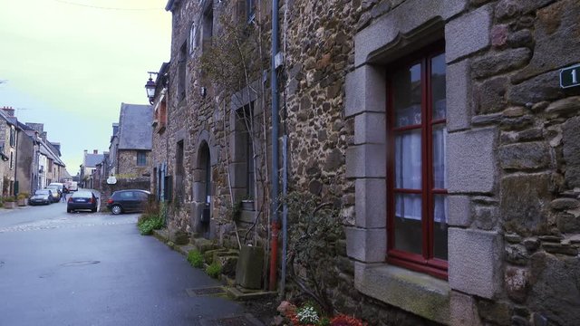 Ancient street with cobblestone road and historic houses, Brittany, France
