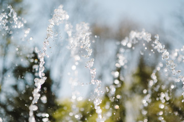 Flow of water fountain. Water splash in a fountain, abstract image.