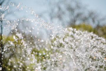 Flow of water fountain. Water splash in a fountain, abstract image.