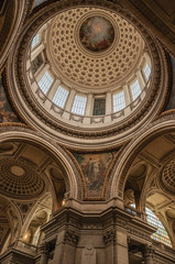 Obraz premium Inside view of the colorful and richly decorated Pantheon dome and ceiling in Paris. Known as one of the most impressive world’s cultural center. Northern France.
