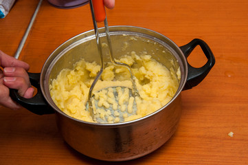 puree from potatoes, in a saucepan boiled potatoes, mash