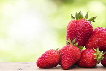 natural strawberries with natural green background