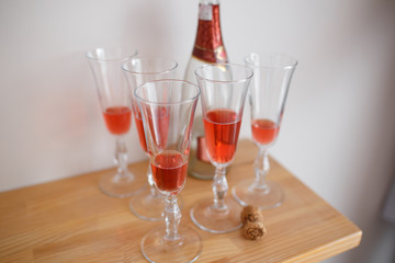 group of glasses with pink champagne on a high-class reception