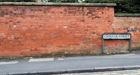 Street Sign Against Brick Wall