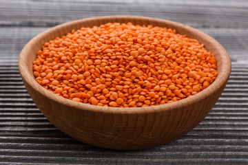 raw lentils on a wooden rustic background