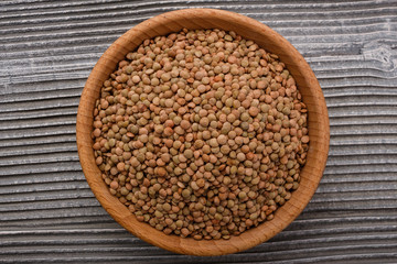 raw lentils on a wooden rustic background