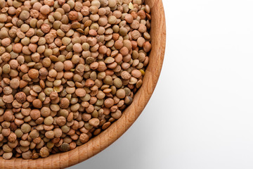 raw lentils on a white acrylic background
