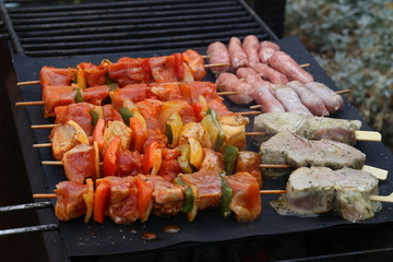 Meat with vegetables grilled on a grill