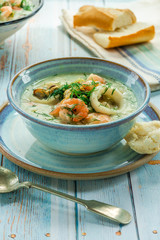 Creamy seafood stew garnished with fresh dill