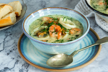 Creamy seafood stew garnished with fresh dill