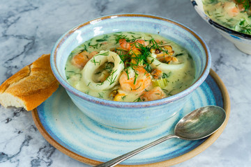 Creamy seafood stew garnished with fresh dill