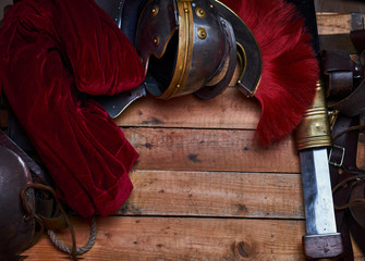 Complete combat equipment of the ancient Greek warrior on a wooden boards.