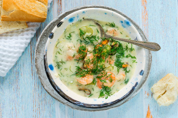 Creamy seafood stew garnished with fresh dill - top view