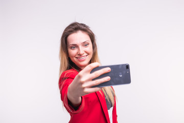 Naklejka premium Beautiful young woman making selfie