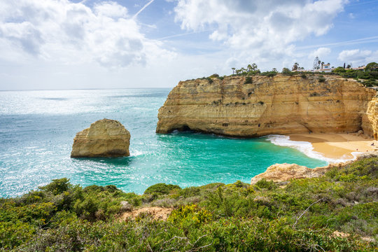 View of beautiful Marinha beach with crystal clear turquoise water near Carvoeiro town, Algarve region, Portugal